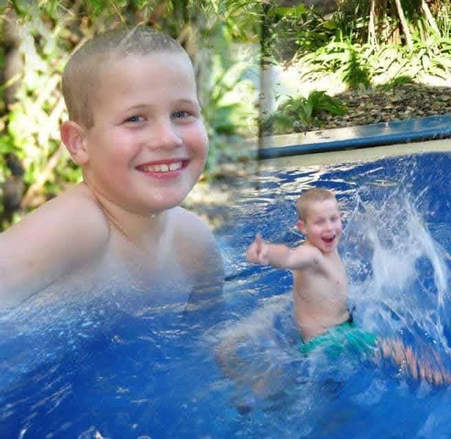 Bailey as a child smiling in the pool